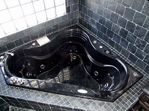 Bathroom tile and stone installation, black granite jaccuzi
