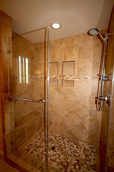 Glass blocks and stone tile in a bathroom remodel.