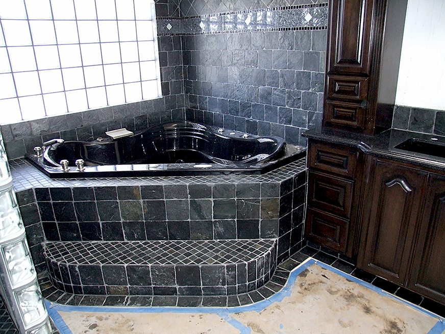 Black granite tile work, jacuzzi installation