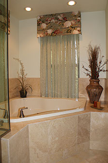 Stone facings on Jacuzzi tub, and stone flooring by Rock Solid Creations, Inc.