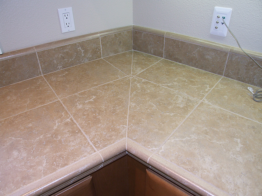 Kitchen counter with stone tiling.