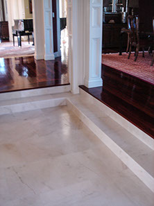 Quartz flooring and stone column facings by Rock Solid Creations, Inc.