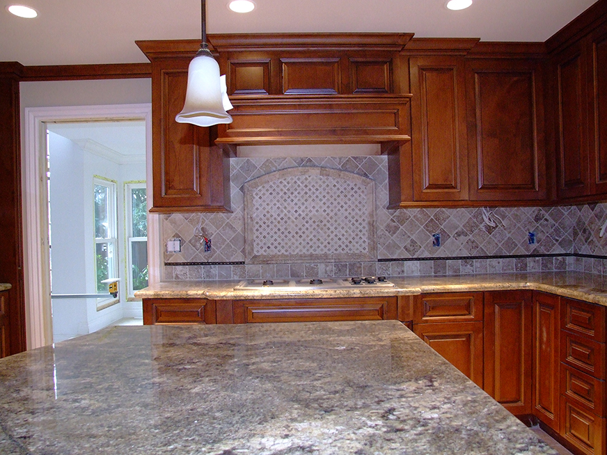 Kitchen stone countertops and tile backsplash, design and installation.