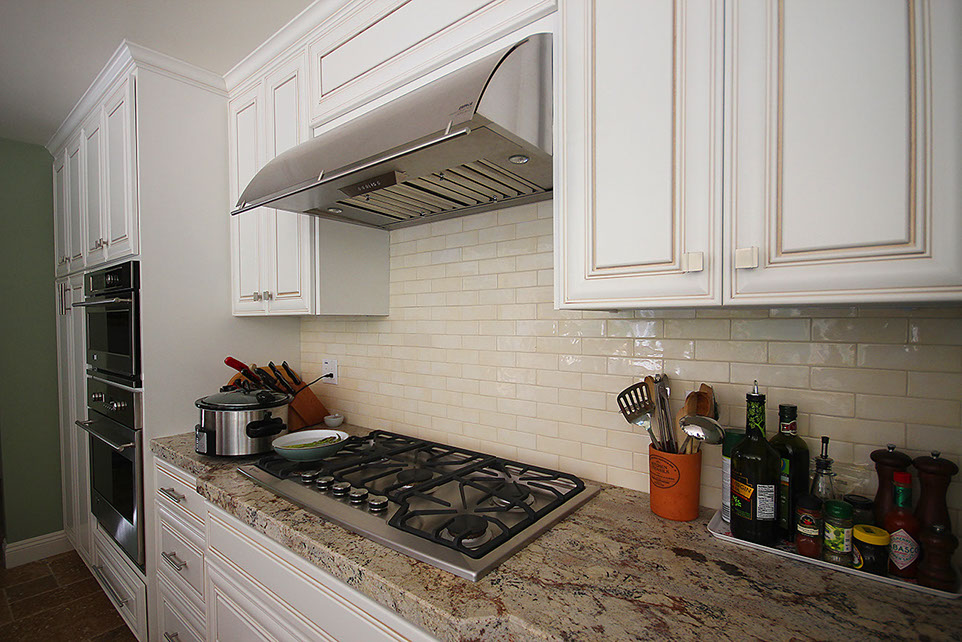 Kitchen granite countertop and ceramic tile backsplash custom installation. 
