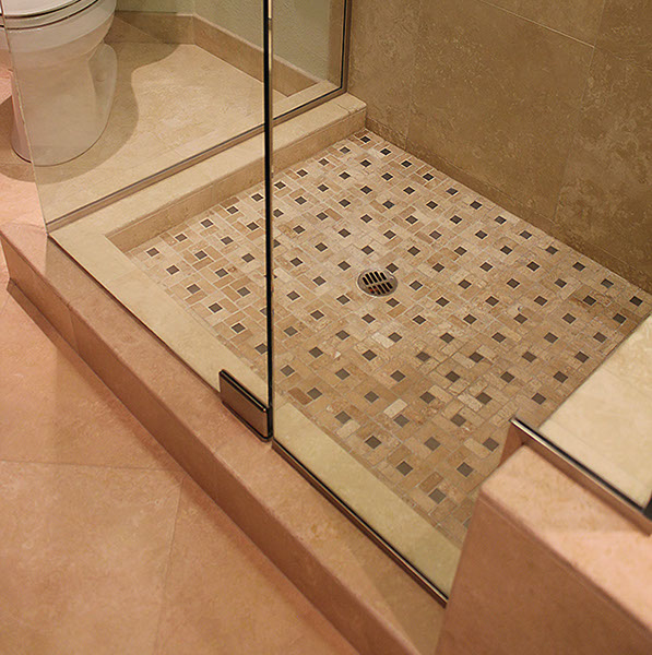 Patterned stone tile floor for shower stall.