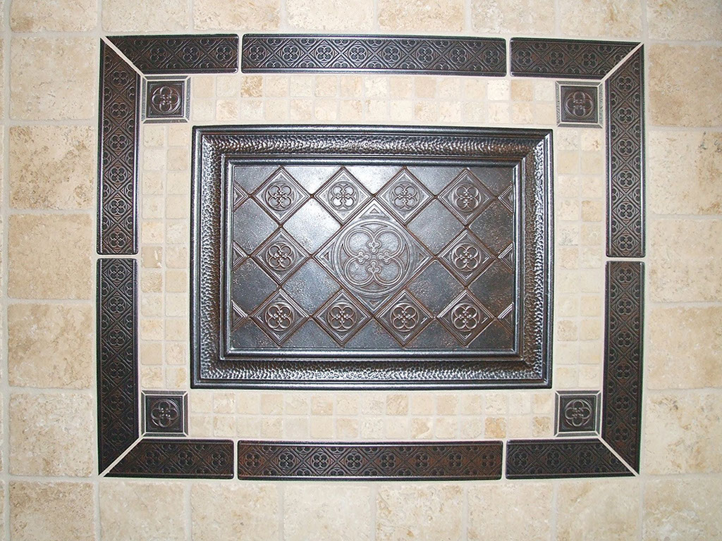 Beautiful stone tile wall with ceramic tile detailing.